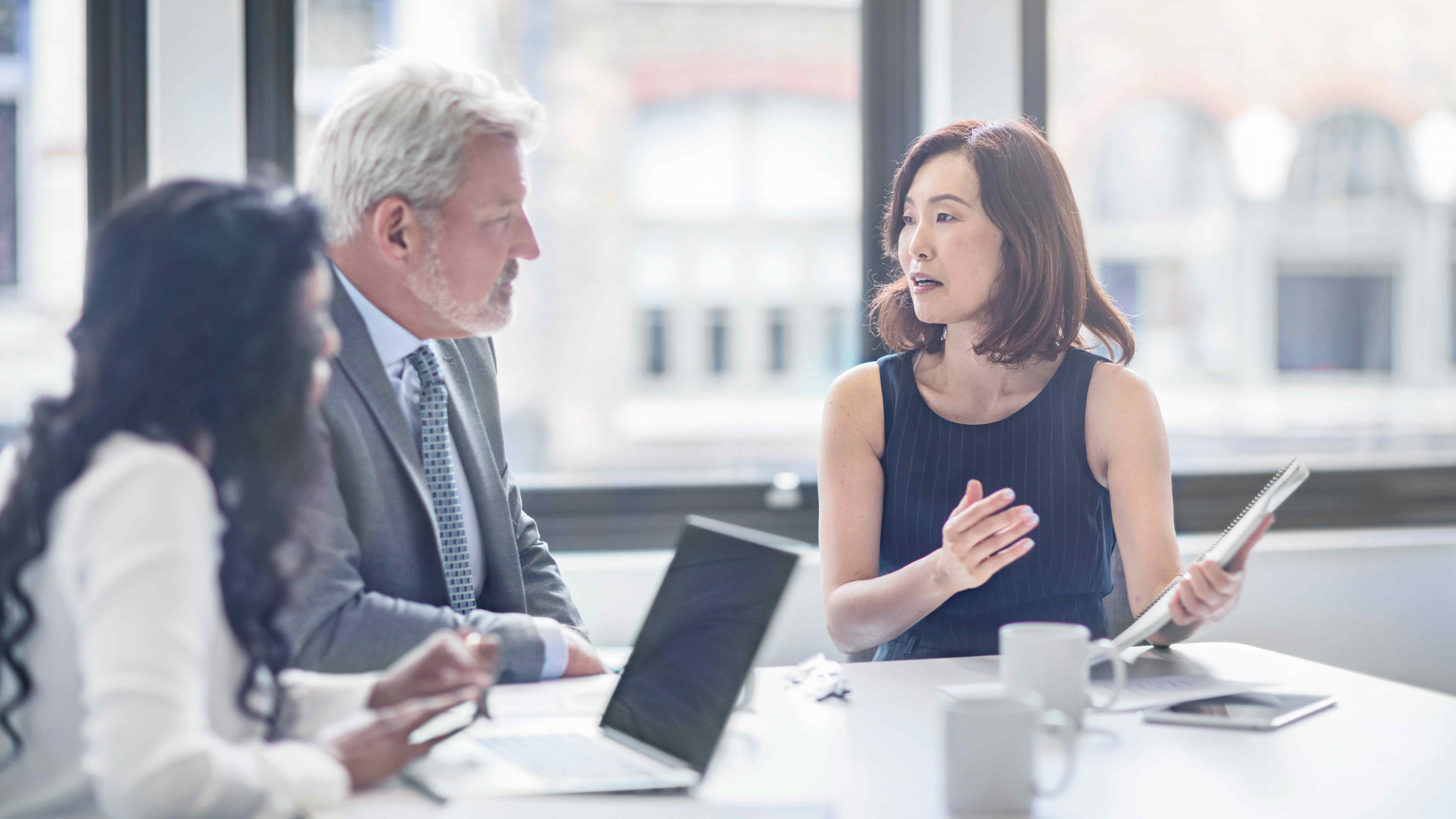 professionals discussing financial data